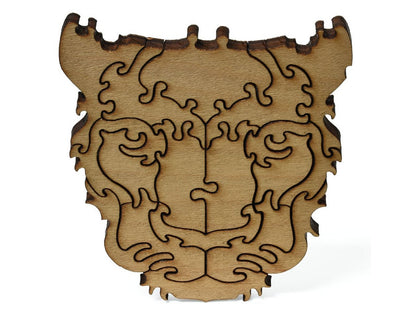 A closeup of pieces shaped like a large leopard head.