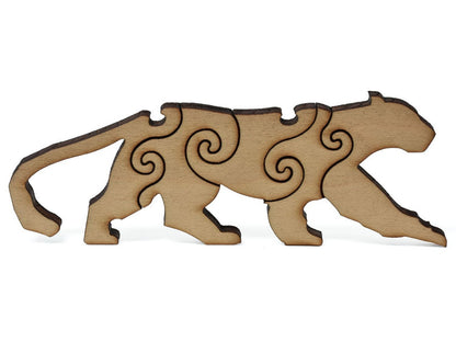 A closeup of pieces shaped like a leopard.
