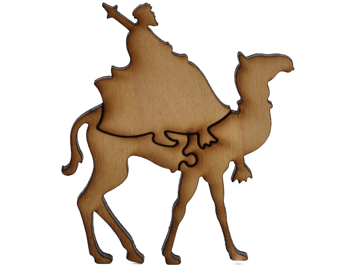 A closeup of pieces shaped like a man riding a camel.