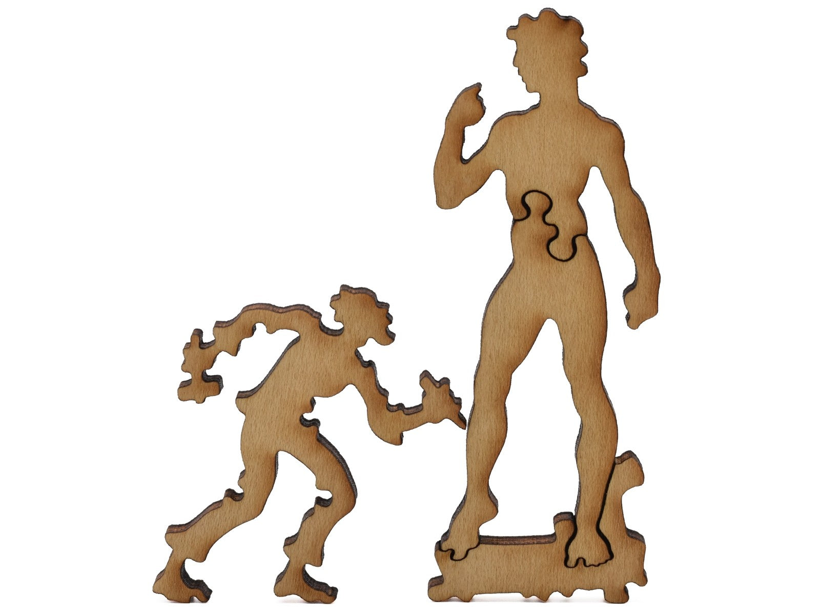 A closeup of pieces shaped like Michelangelo and the David.