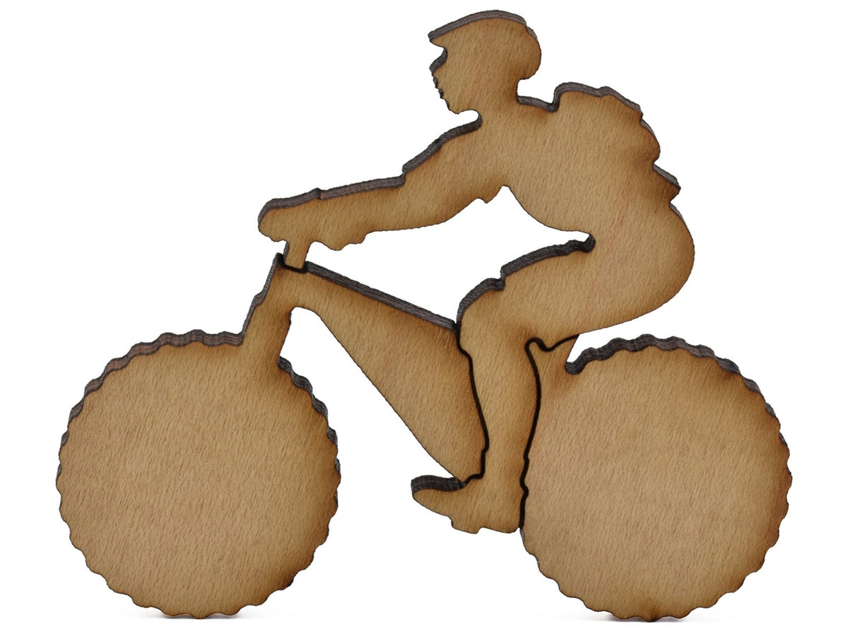 A closeup of pieces shaped like a person riding a mountain bike.