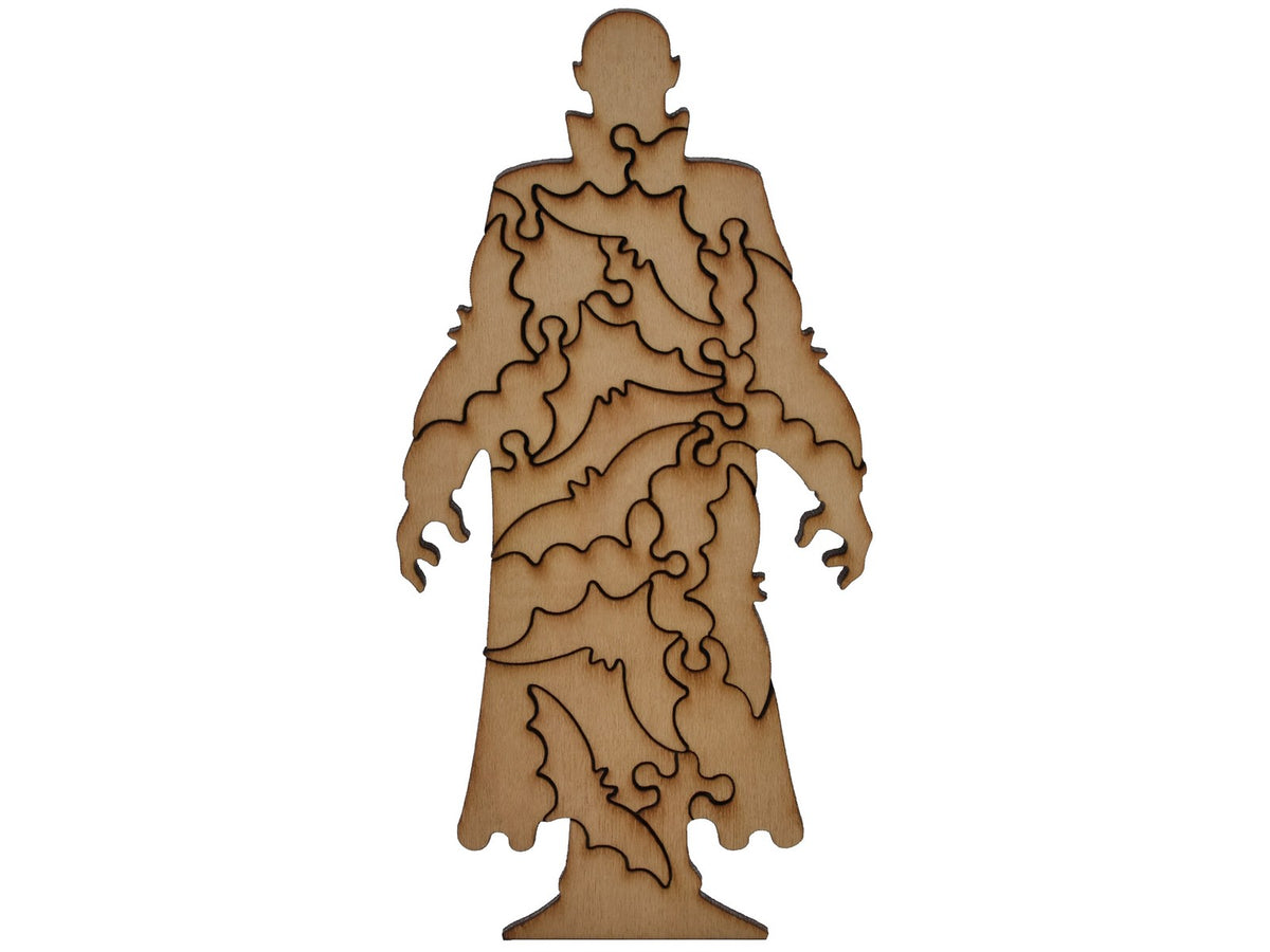 A closeup of pieces shaped like a large Nosferatu with bats inside of him.