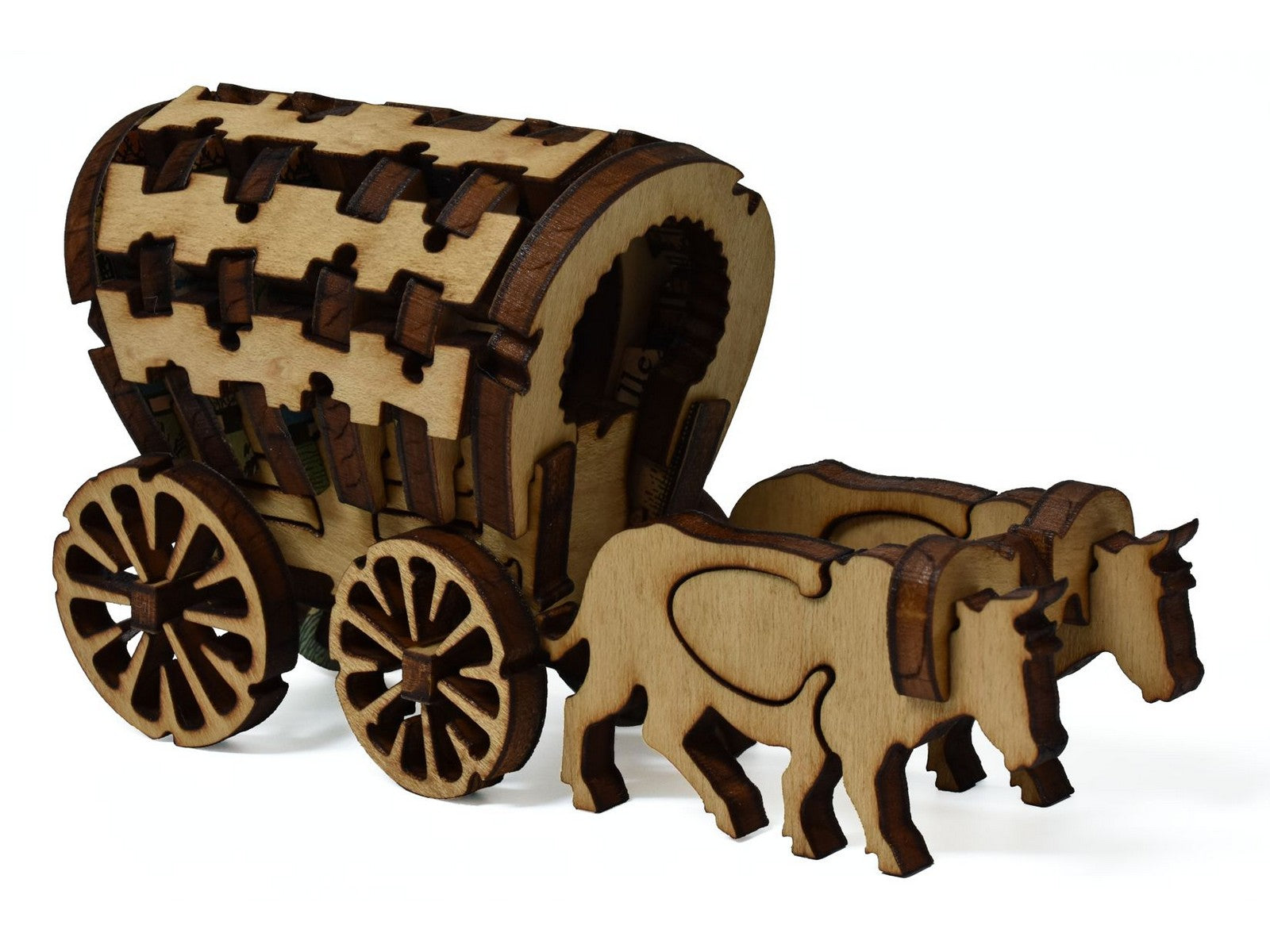 A closeup of pieces showing a three dimensional wagon being pulled by two oxen.