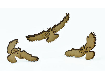 A closeup of pieces in the shape of flying birds.