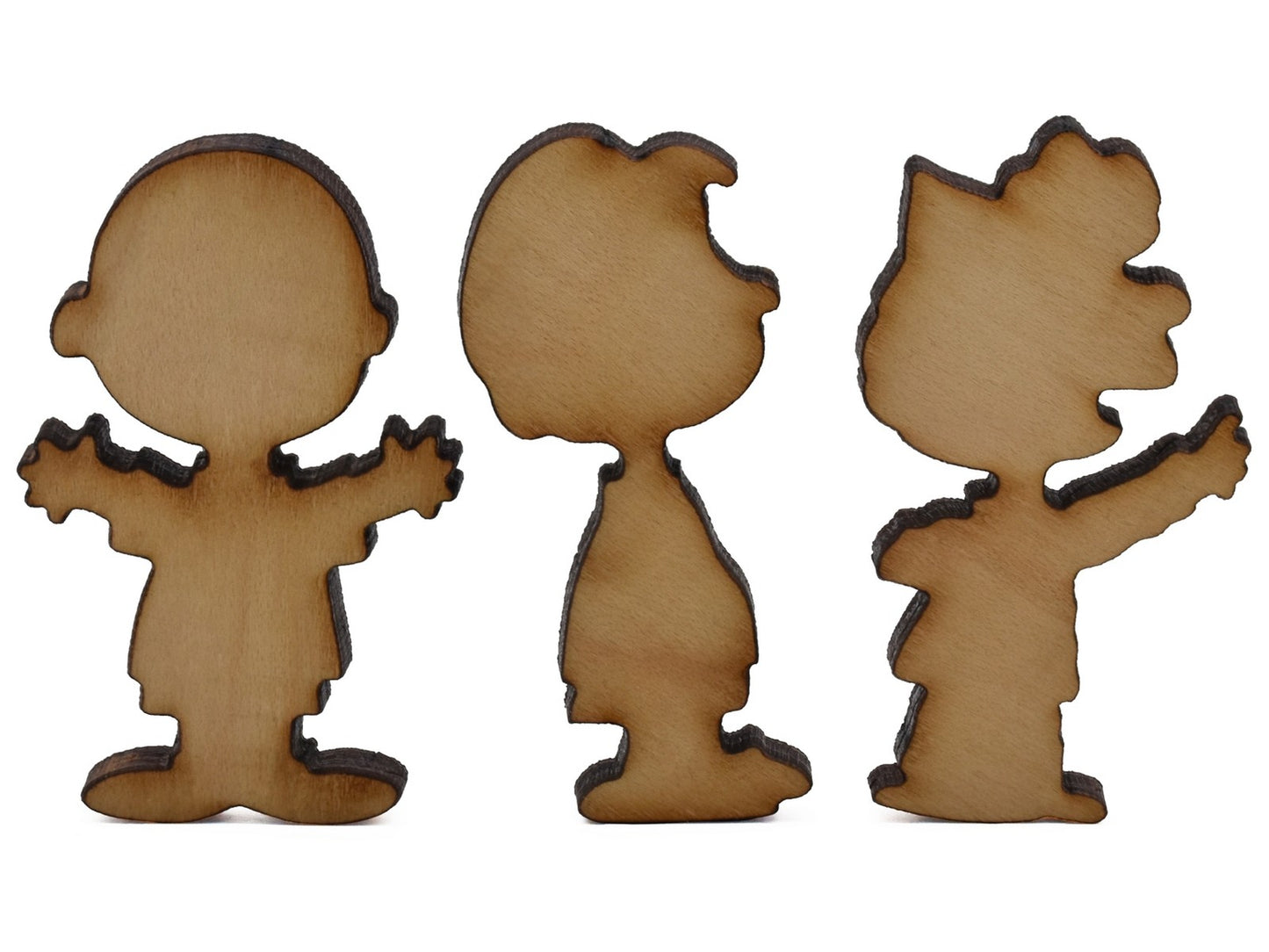 A closeup of pieces shaped like some of the Peanuts gang.