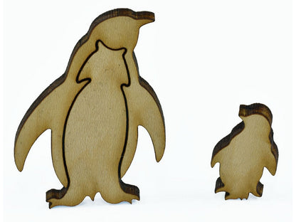 A closeup of pieces shaped like a penguin with its baby.