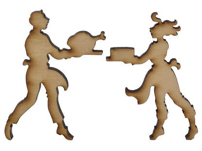A closeup of pieces shaped like two people holding platters of food.