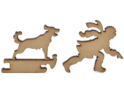 A closeup of pieces shaped like a person pulling a sled with a dog riding it.