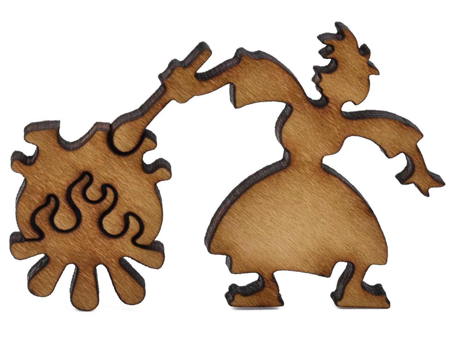 A closeup of pieces shaped like a person with a cauldron on a fire.