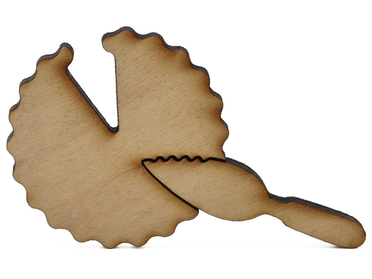 A closeup of pieces shaped like a pie with a slice missing.