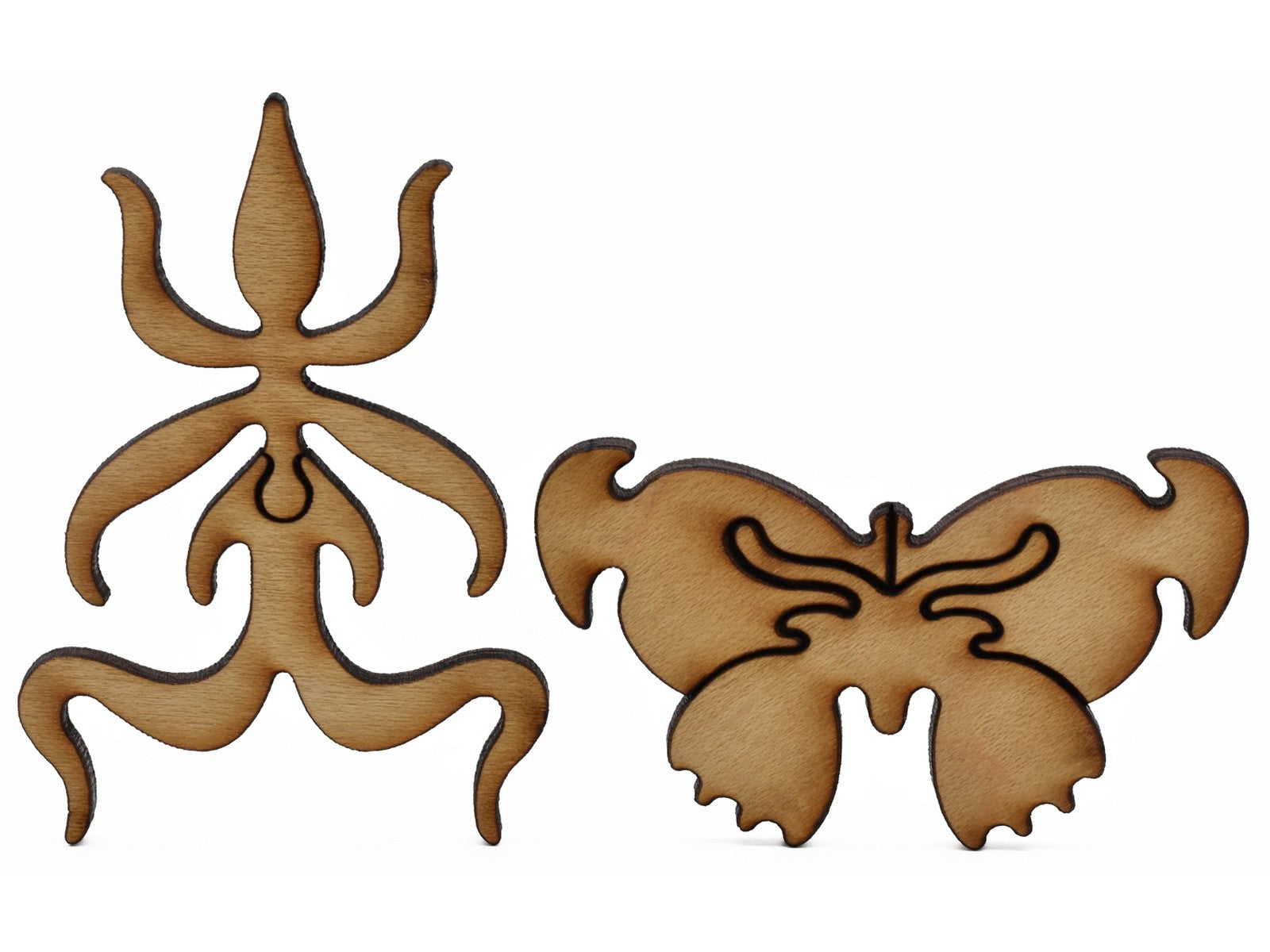 A closeup of pieces shaped like a plant and a butterfly.