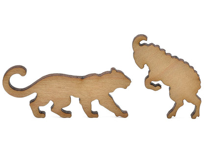 A closeup of pieces shaped like a ram and a leopard.