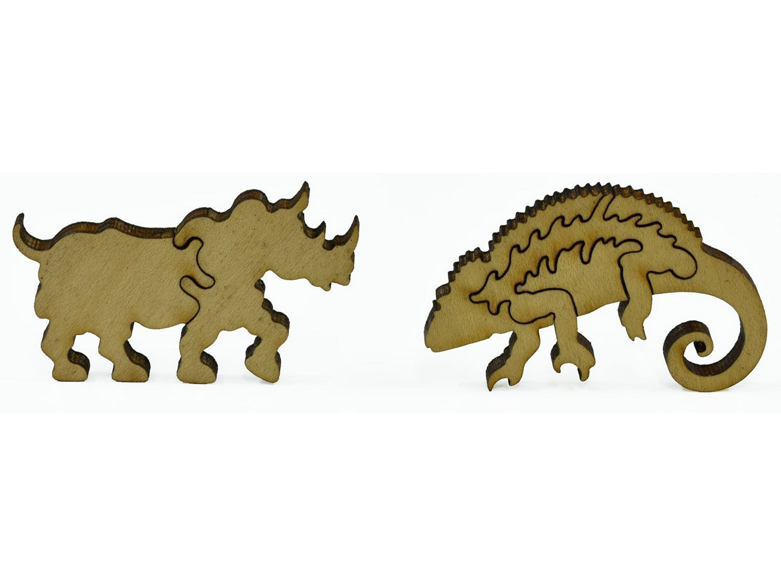 A closeup of pieces showing a rhino and a chameleon.