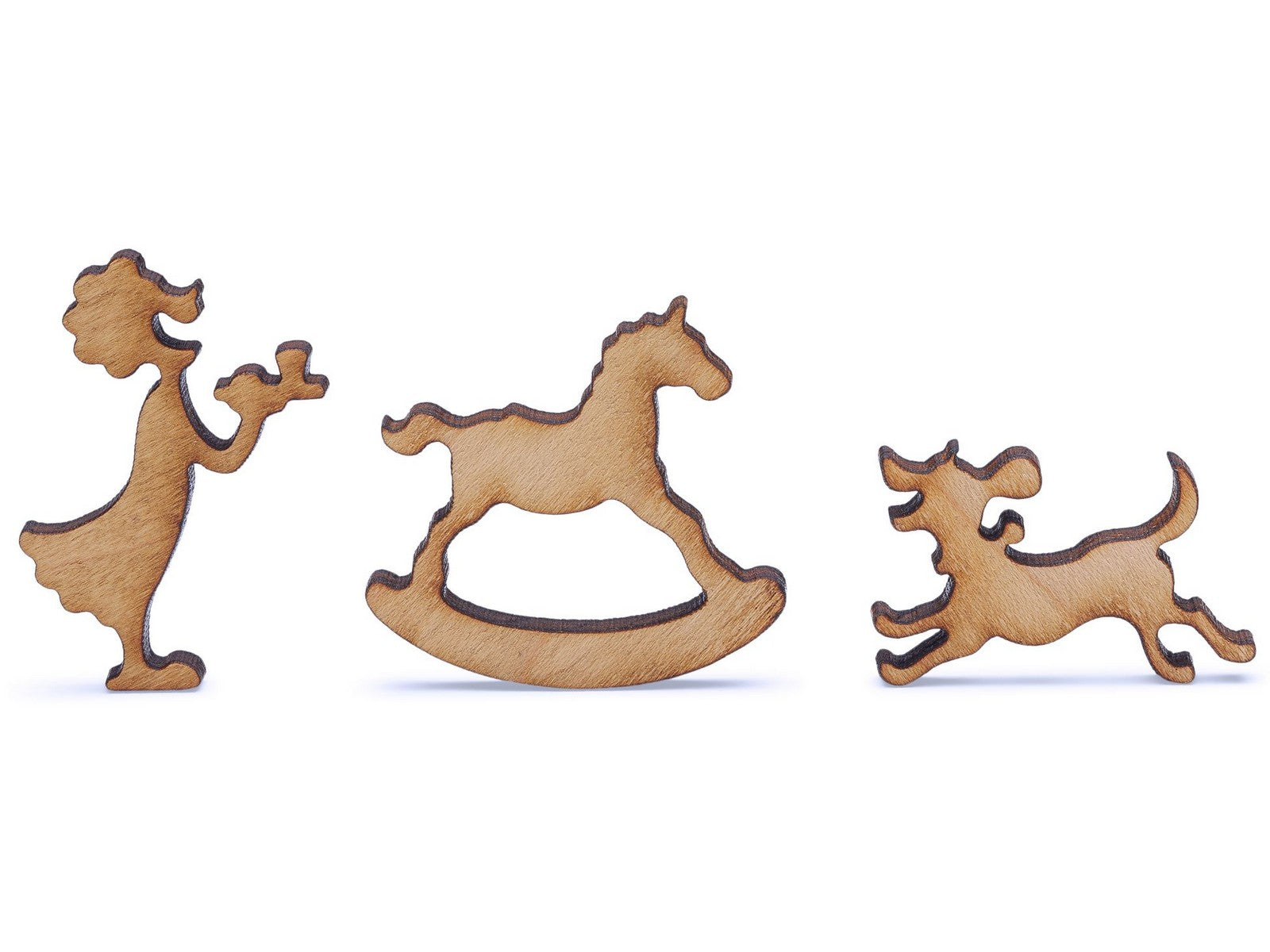 A closeup of pieces shaped like a girl, rocking horse, and a dog.