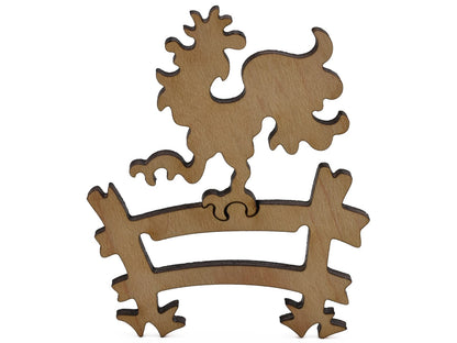 A closeup of pieces shaped like a rooster on a fence.