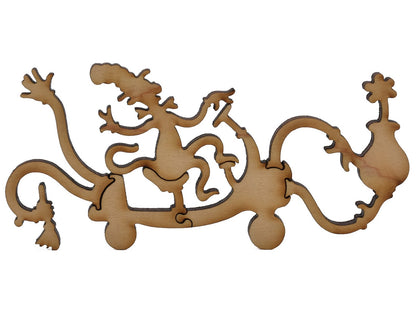 A closeup of pieces shaped like the Cat in the Hat riding on a Suessian vehicle.