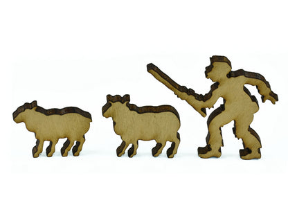 A closeup of pieces in the shape of a farmer and two sheep.