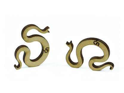 A closeup of pieces in the shape of snakes.