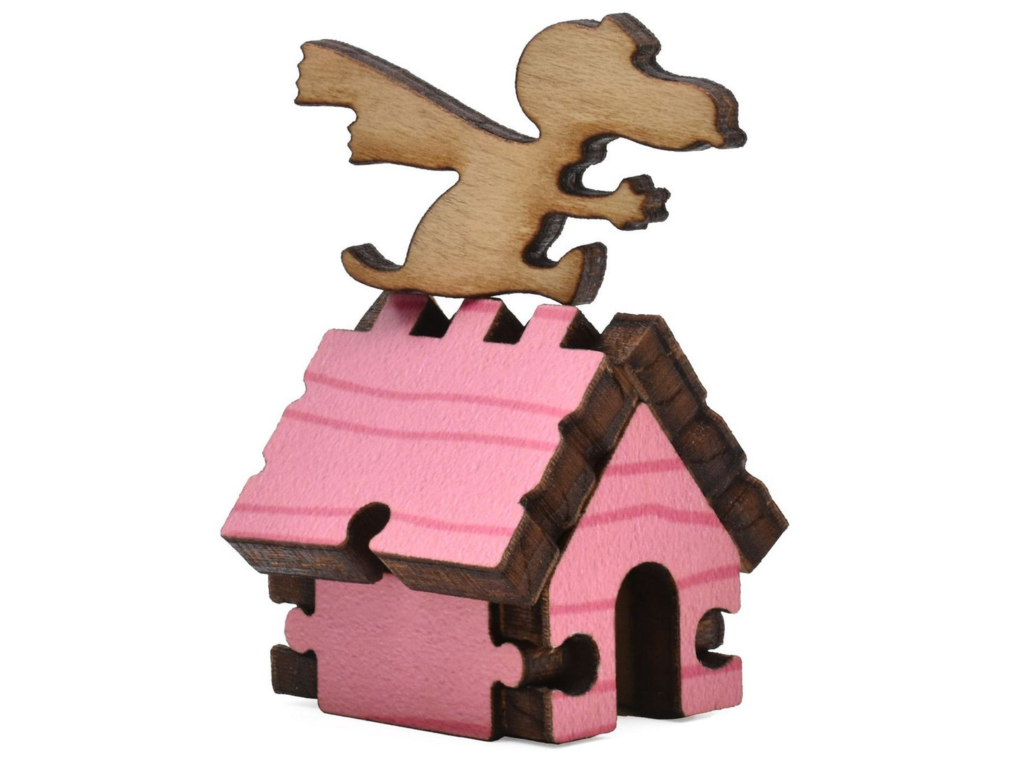 A closeup of pieces shaped like Snoopy sitting on the roof of his doghouse.