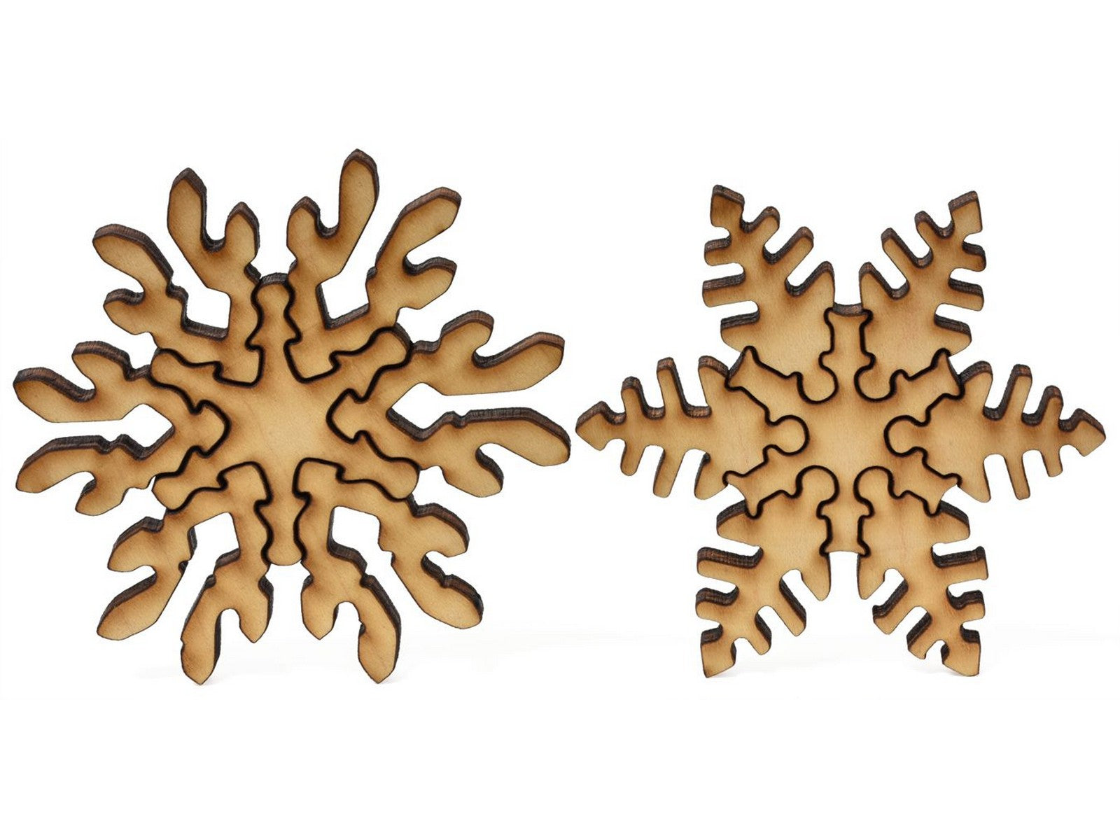 Second image for A closeup of pieces showing two fancy multi-piece snowflakes.