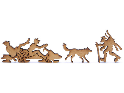 A closeup of pieces shaped like two snowmobilers, a skier, and a dog.