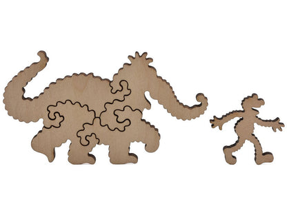 A closeup of pieces shaped like Snuffleaupagus and Elmo.