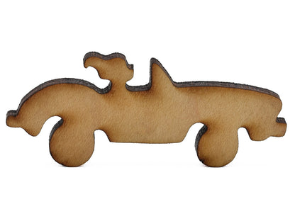 A closeup of pieces shaped like a sports car. 