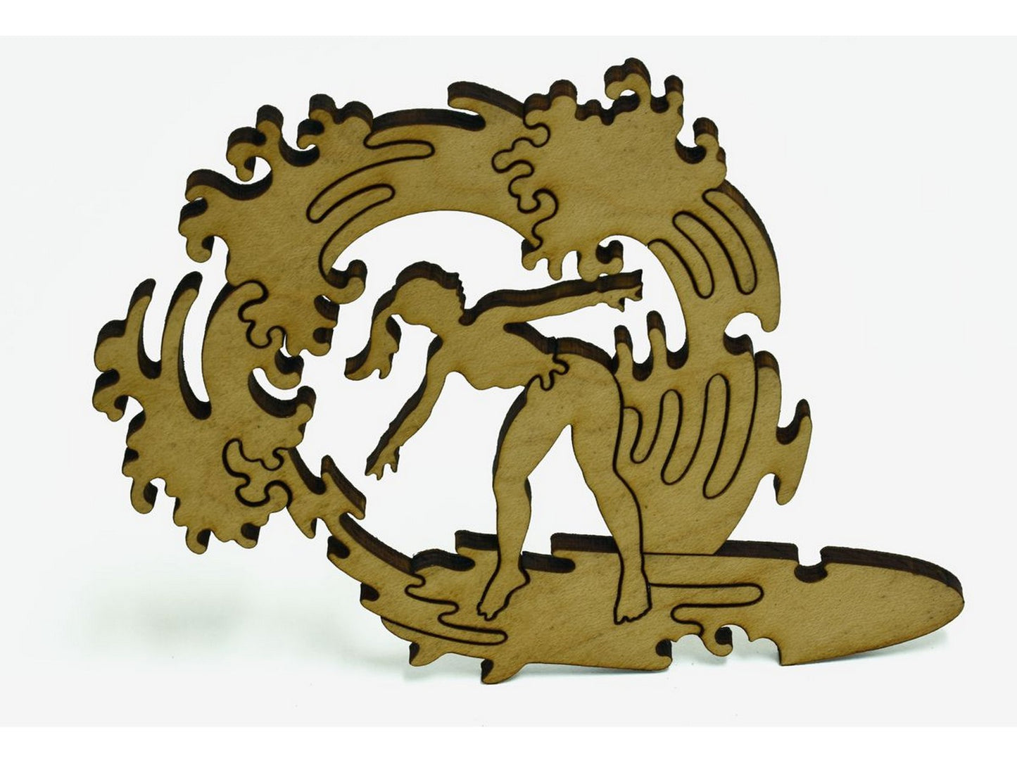 A closeup of pieces shaped like a woman surfing.