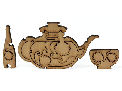 A closeup of pieces showing a multi-piece teapot and teacups.