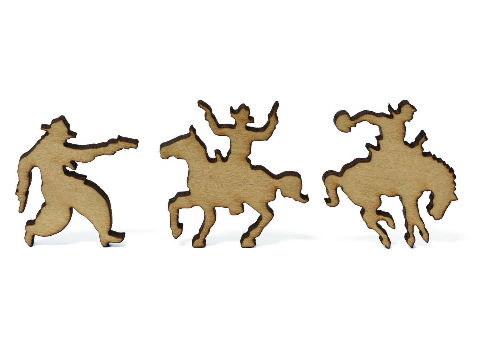A closeup of pieces in the shape of three cowboys.