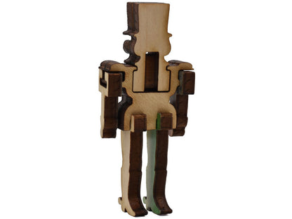 A closeup of pieces shaped like a three dimensional nutcracker.