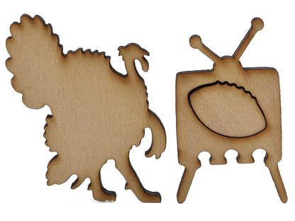 A closeup of pieces shaped like a turkey and a television with football on it.