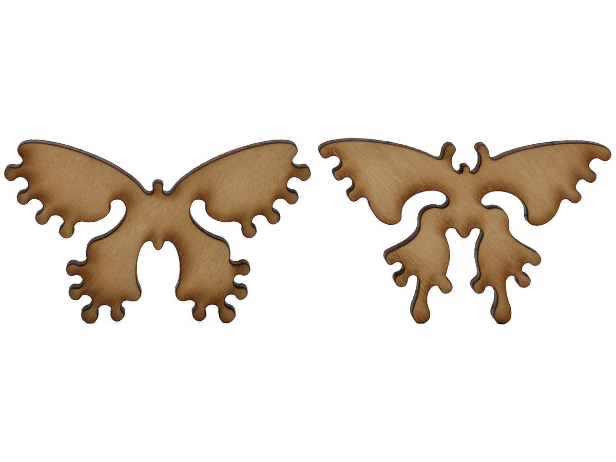 A closeup of pieces shaped like two butterflies.