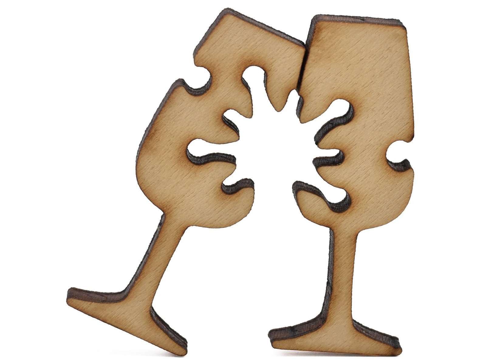 A closeup of pieces shaped like two champagne glasses.