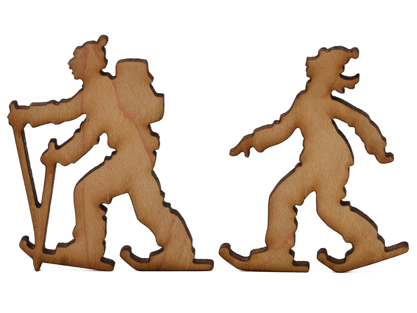 A closeup of pieces shaped like two cross country skiers.