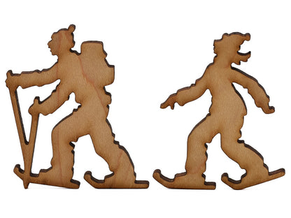 A closeup of pieces shaped like two cross country skiers.