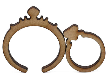 A closeup of pieces shaped like two diamond rings.