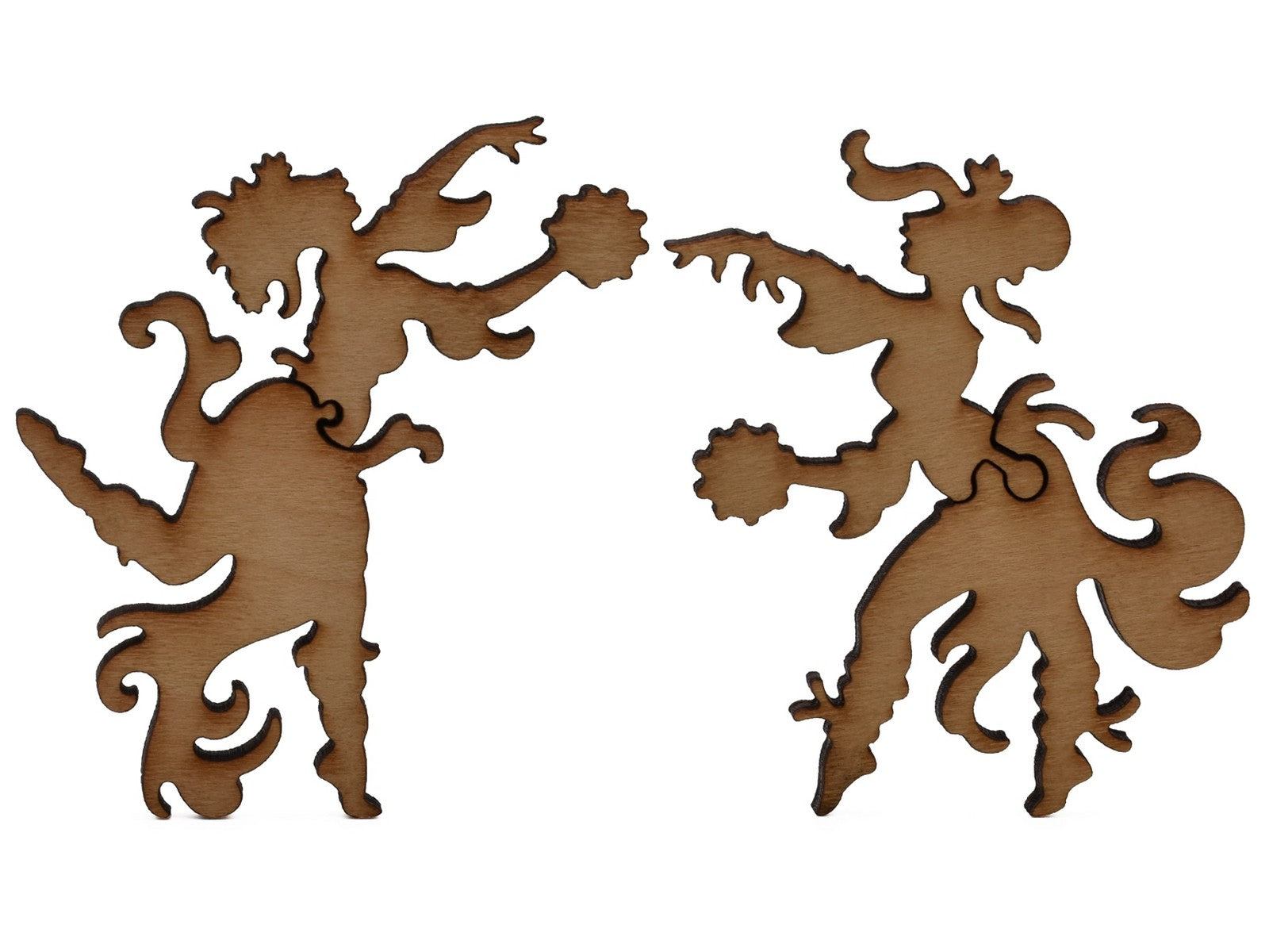 A closeup of pieces shaped like two fairies dancing.