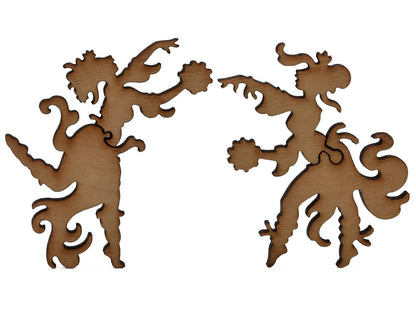 A closeup of pieces shaped like two fairies dancing.