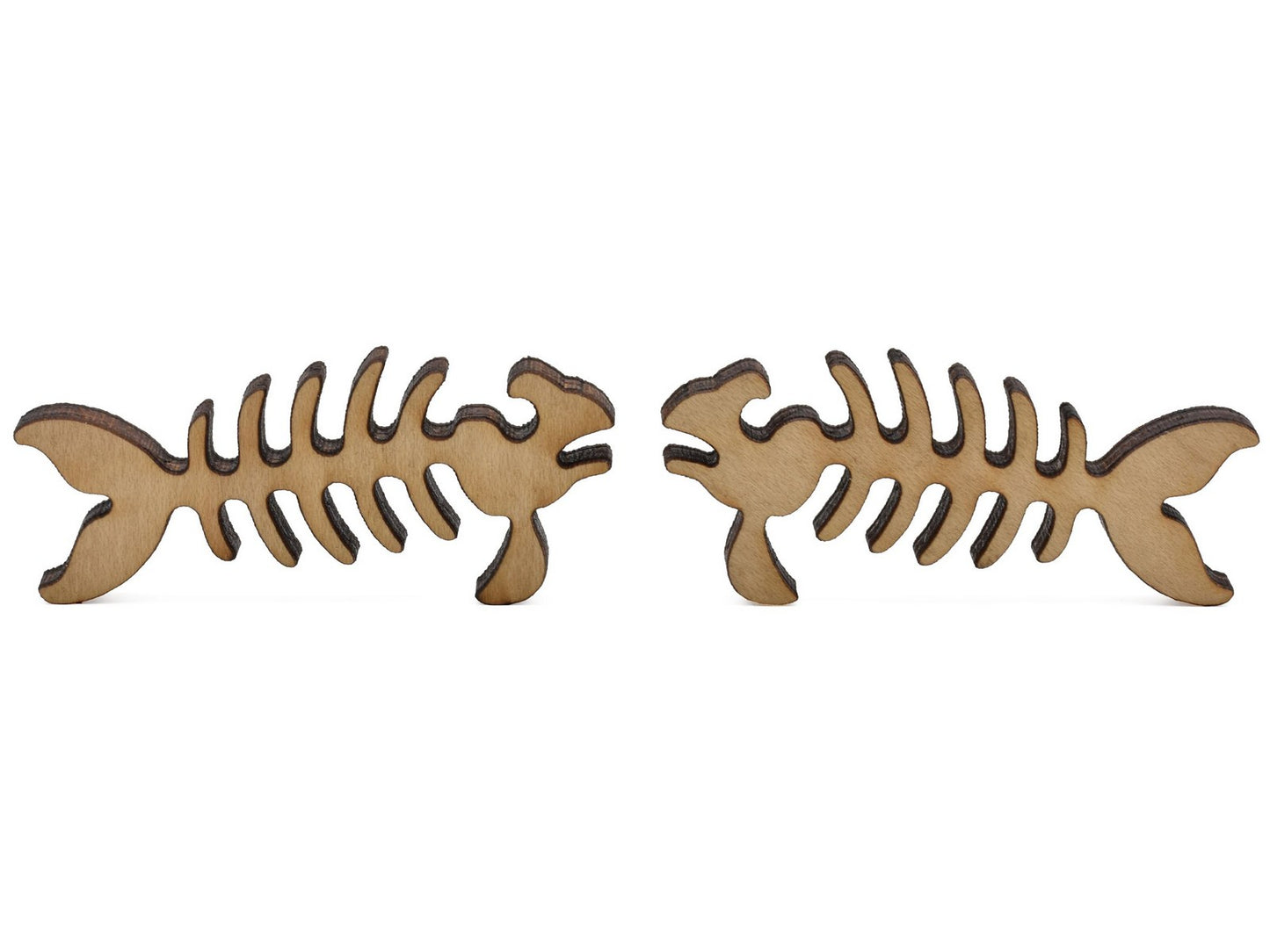 A closeup of pieces shaped like two fish skeletons.