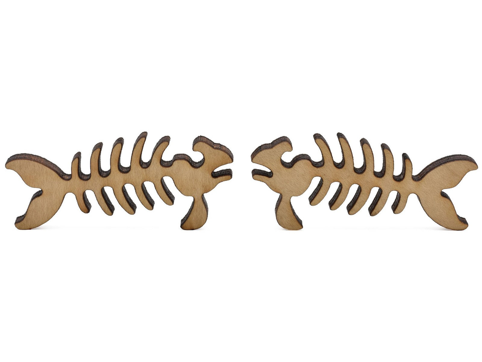 A closeup of pieces shaped like two fish skeletons.