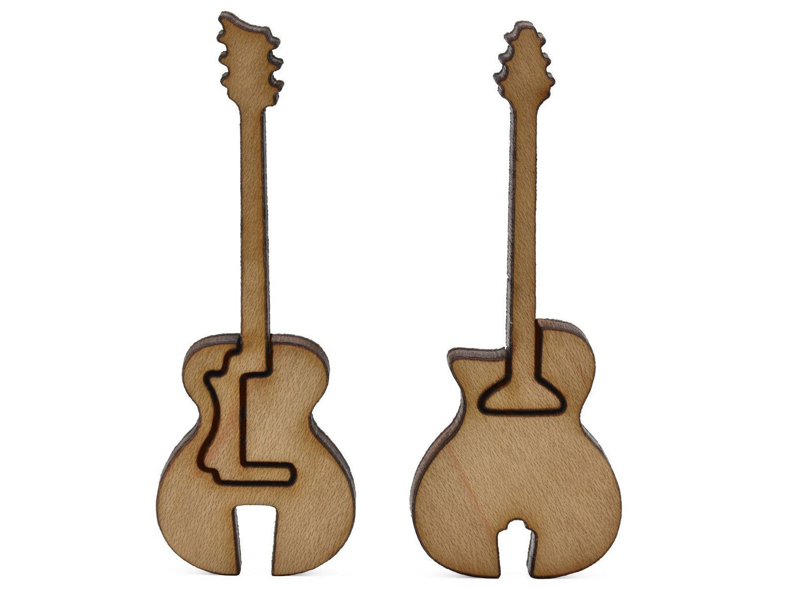 A closeup of pieces shaped like two Gitane guitars.