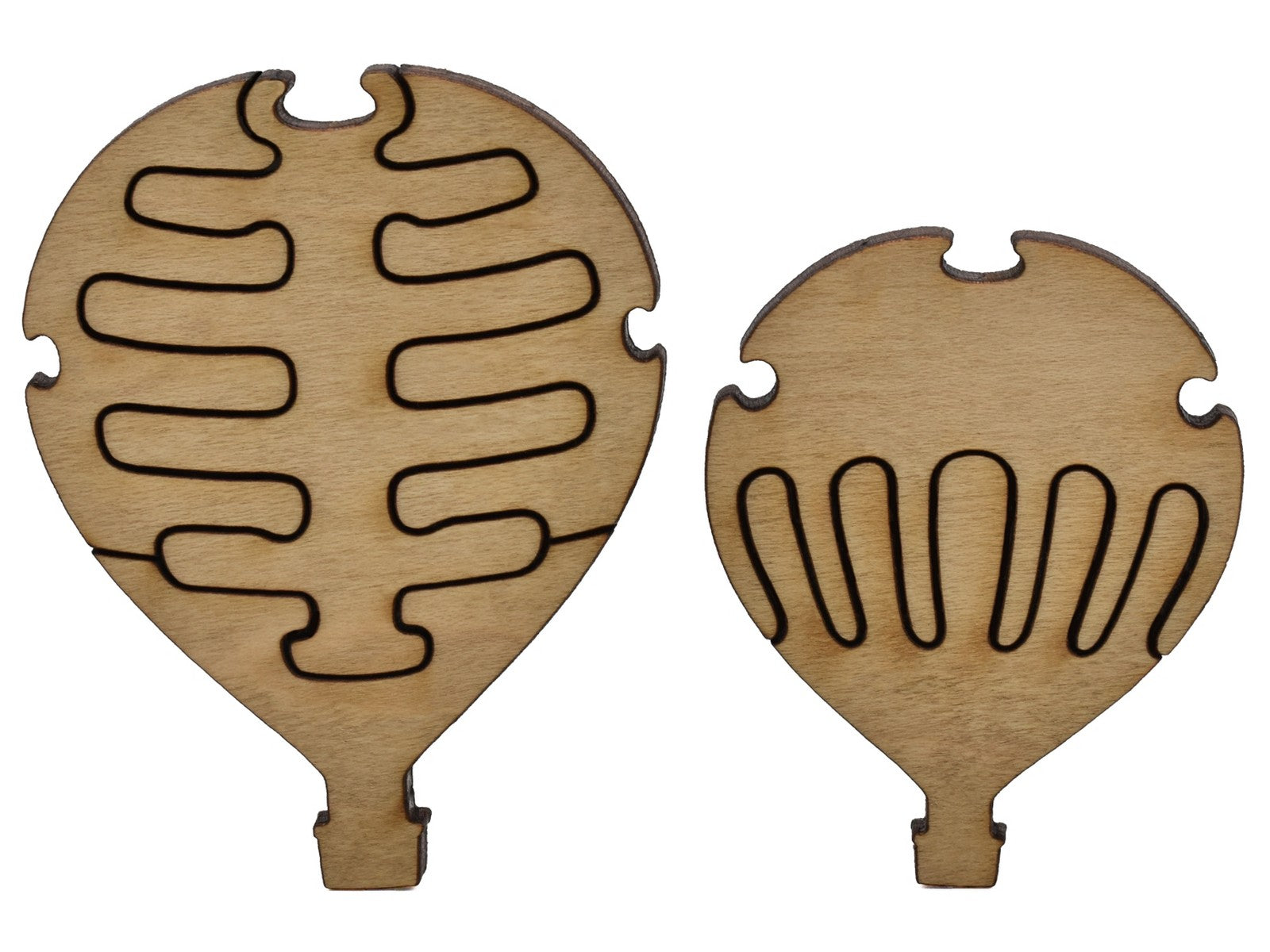 A closeup of pieces shaped like two smaller hot air balloons.