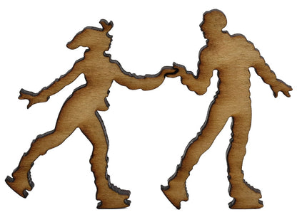 A closeup of pieces shaped like two people ice skating.
