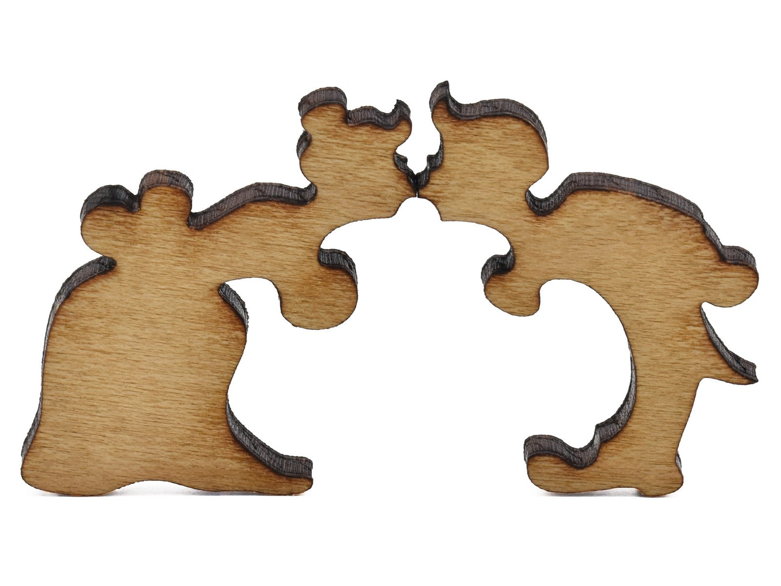 A closeup of pieces shaped like two people kissing.