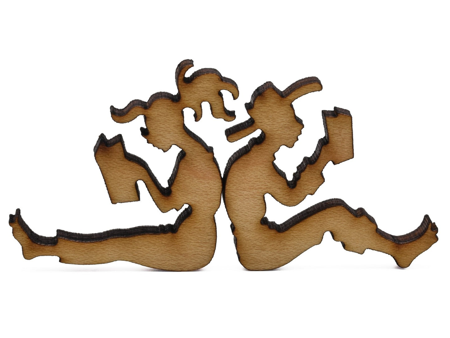 A closeup of pieces shaped like two people sitting back to back and reading.