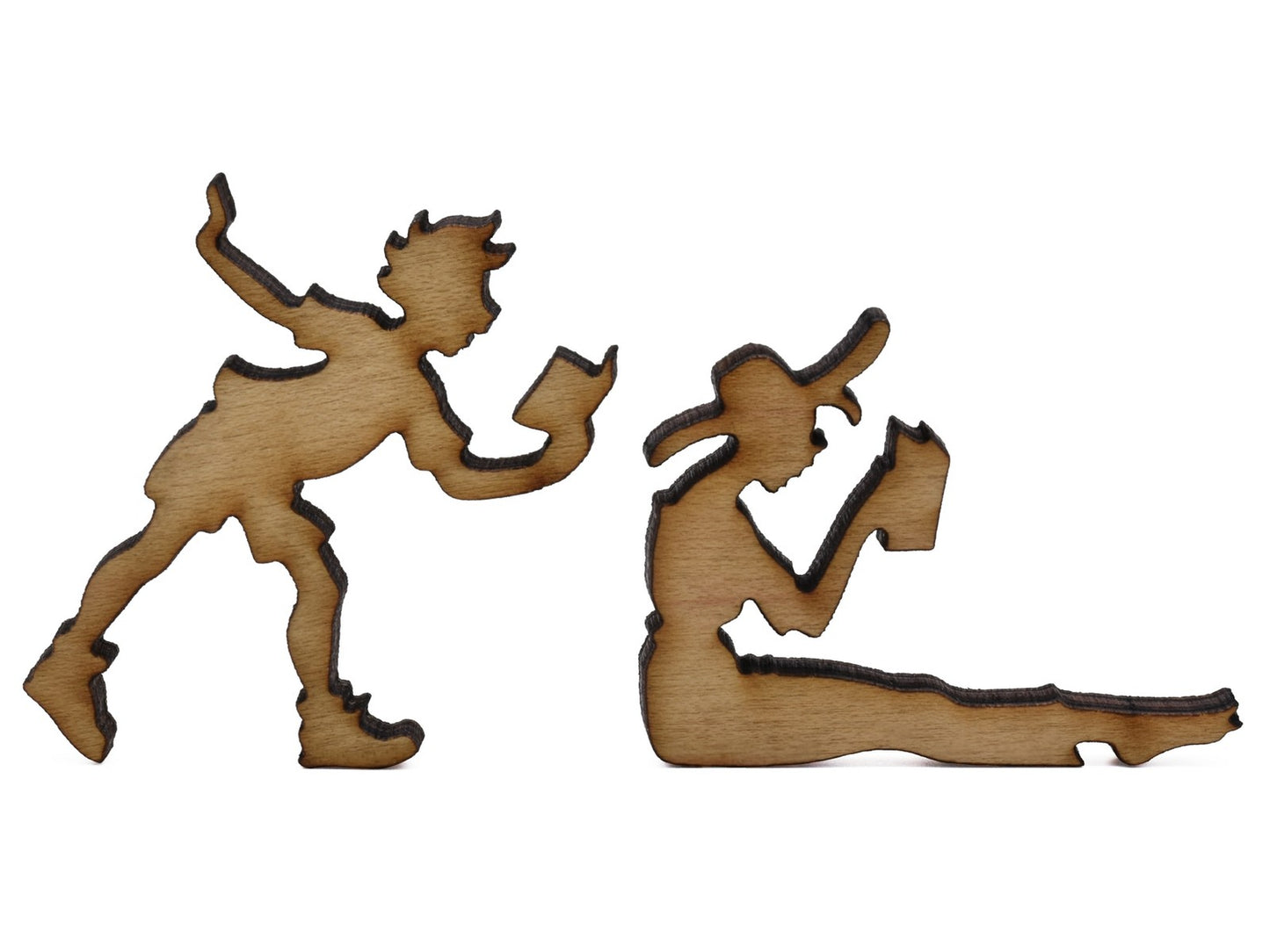 A closeup of pieces shaped like two people reading.