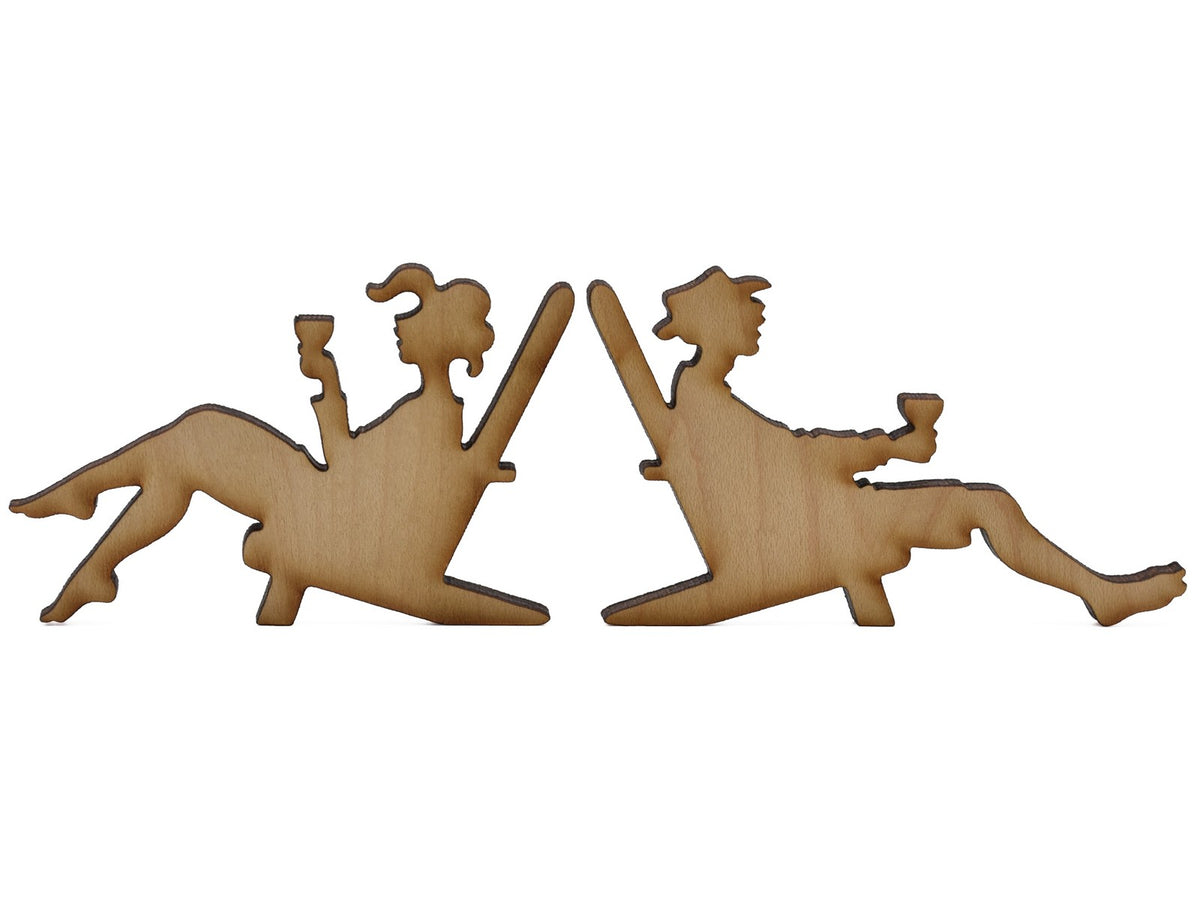 A closeup of pieces shaped like two people in beach chairs.