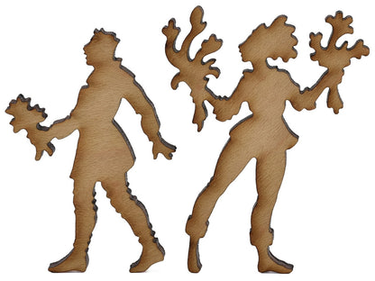 A closeup of pieces shaped like two people with bouquets of flowers.