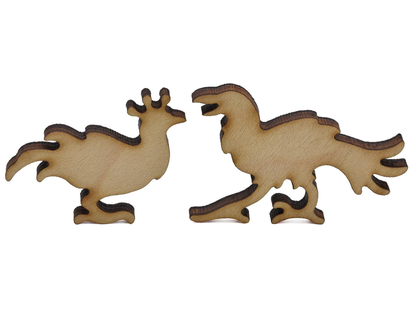 A closeup of pieces shaped like two small birds.